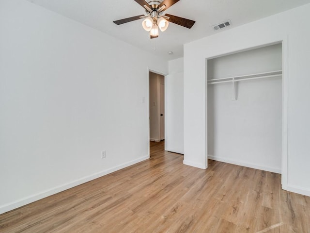 unfurnished bedroom featuring a closet, ceiling fan, and light hardwood / wood-style flooring