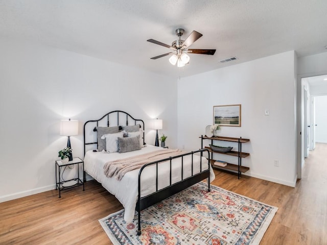 bedroom featuring ceiling fan and hardwood / wood-style floors