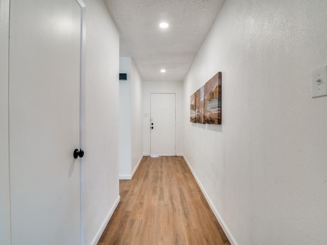 hallway featuring light wood-type flooring