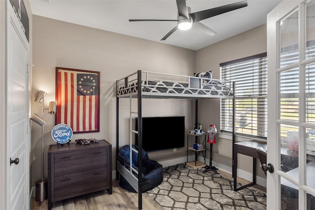 bedroom featuring ceiling fan and hardwood / wood-style floors