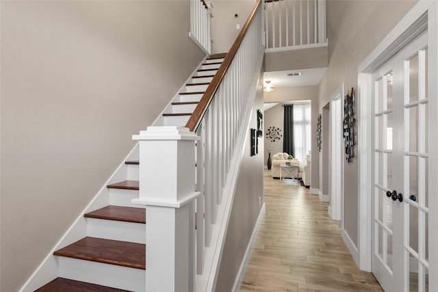 stairway featuring hardwood / wood-style floors