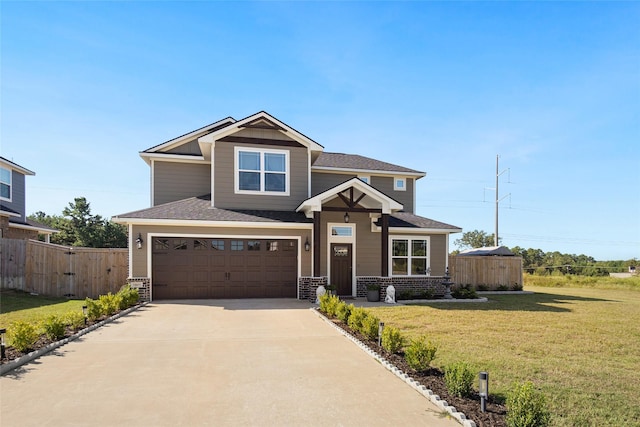 view of front of property featuring a garage and a front lawn