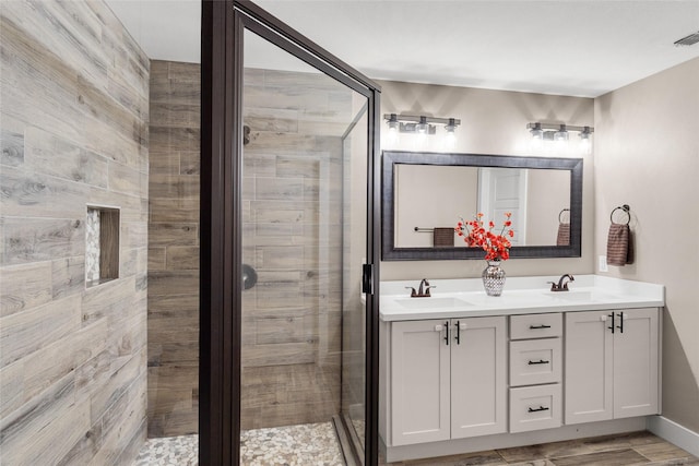 bathroom with vanity and an enclosed shower