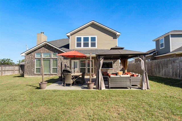 back of house with a gazebo, an outdoor hangout area, a patio area, and a yard