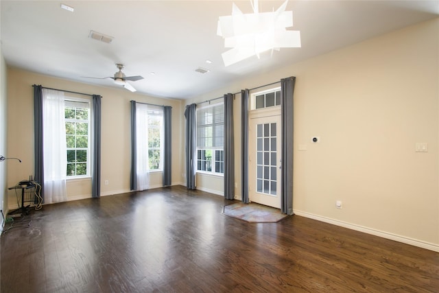 unfurnished room featuring dark hardwood / wood-style flooring and ceiling fan