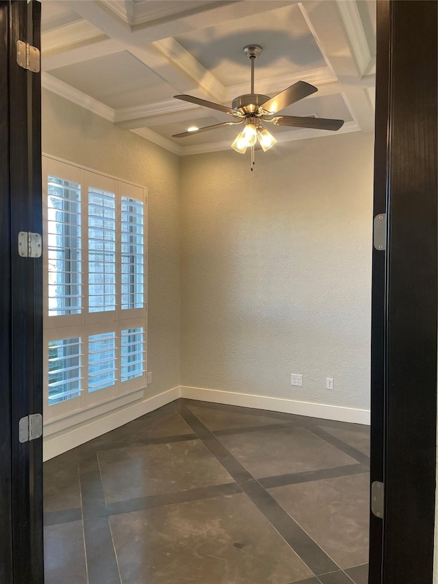 tiled spare room featuring ceiling fan, crown molding, beamed ceiling, and coffered ceiling