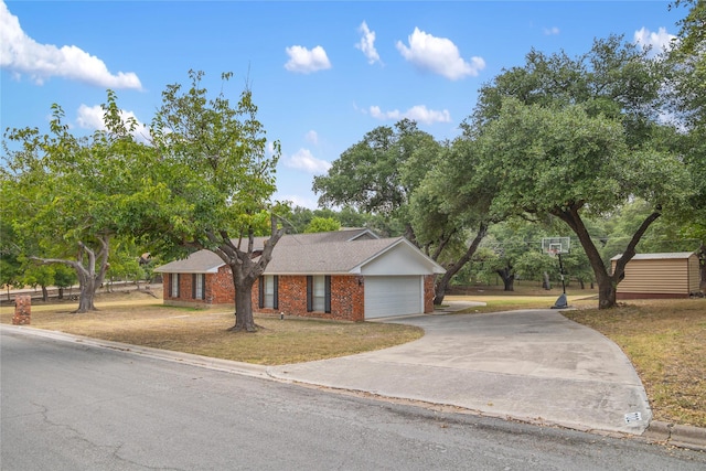 single story home featuring a front yard and a garage