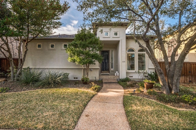 view of front of property with a front lawn