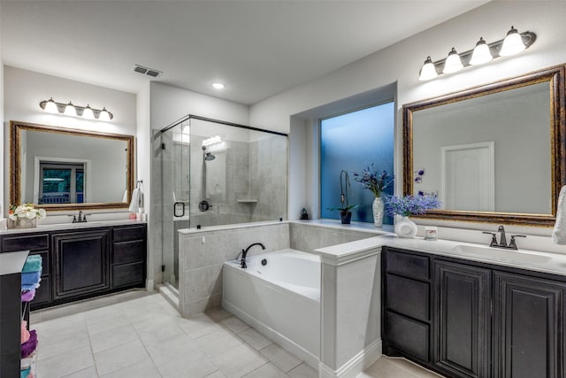 bathroom with vanity, shower with separate bathtub, and tile patterned flooring