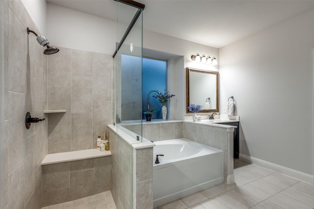 bathroom featuring tile patterned flooring, separate shower and tub, and sink