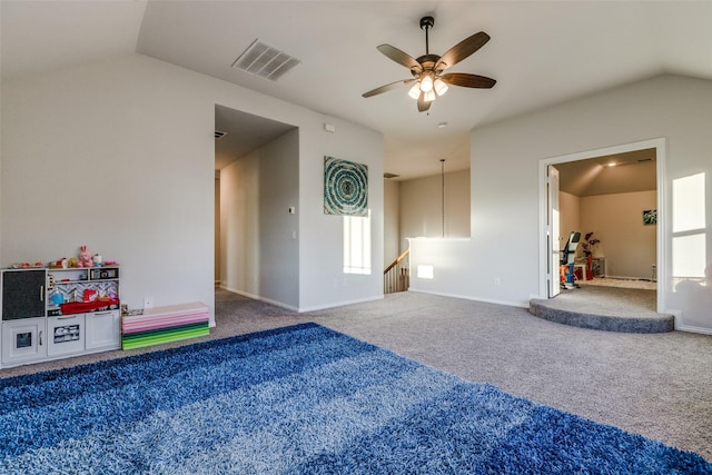 interior space featuring ceiling fan, lofted ceiling, and carpet