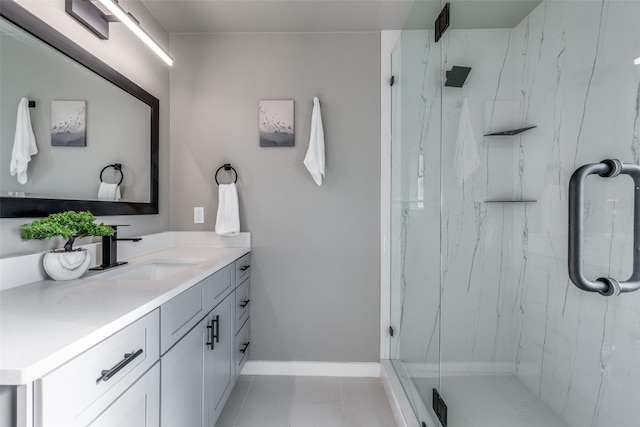 bathroom featuring tile patterned floors, vanity, and a shower with shower door