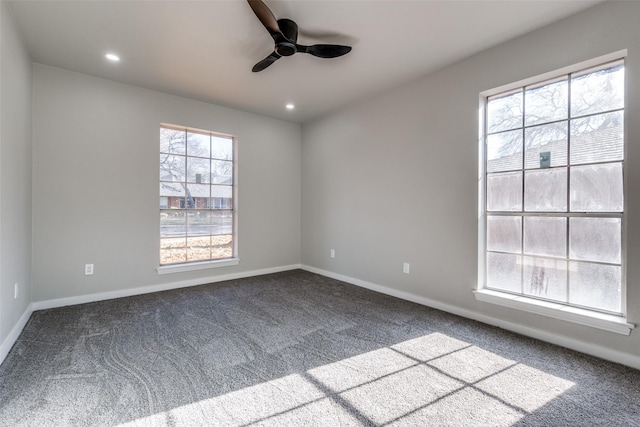 spare room with carpet flooring and ceiling fan