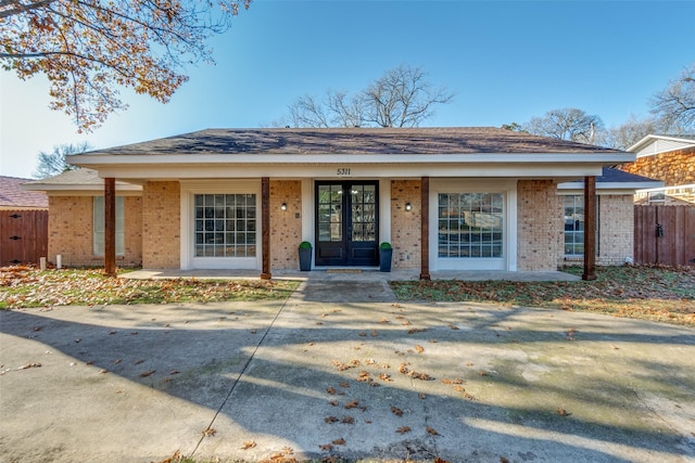 ranch-style house featuring french doors