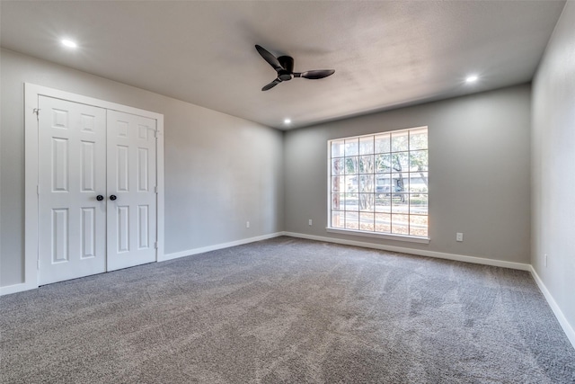 carpeted empty room with ceiling fan