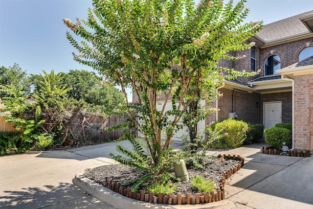 view of side of home featuring a garage