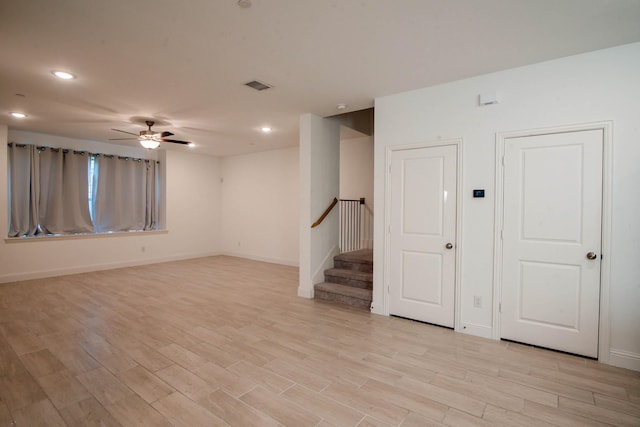 unfurnished room featuring ceiling fan and light hardwood / wood-style flooring