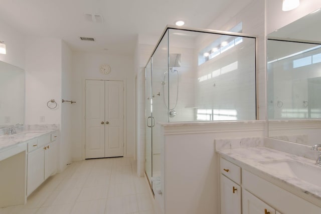 bathroom featuring vanity and an enclosed shower