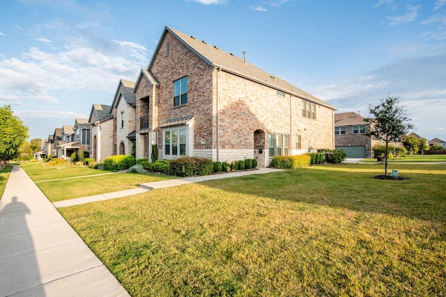 view of side of property with a lawn