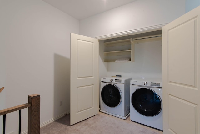 laundry room featuring light colored carpet and independent washer and dryer