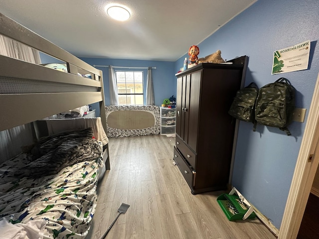 bedroom featuring light wood-type flooring