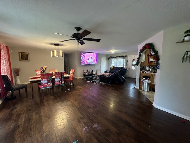 dining room featuring ceiling fan and dark hardwood / wood-style floors