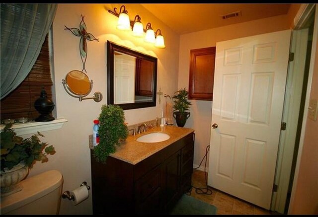 home office with dark hardwood / wood-style floors and ceiling fan