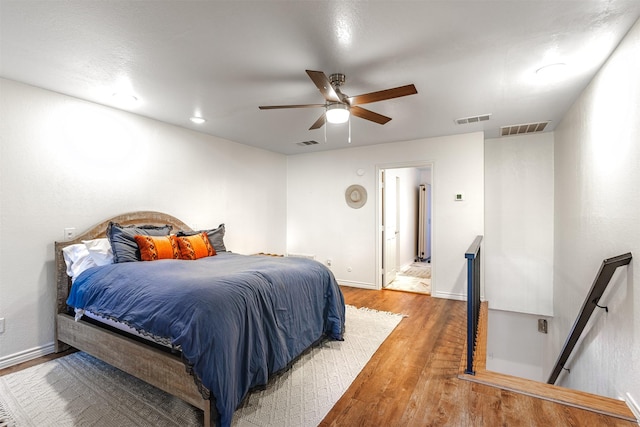 bedroom featuring wood-type flooring and ceiling fan