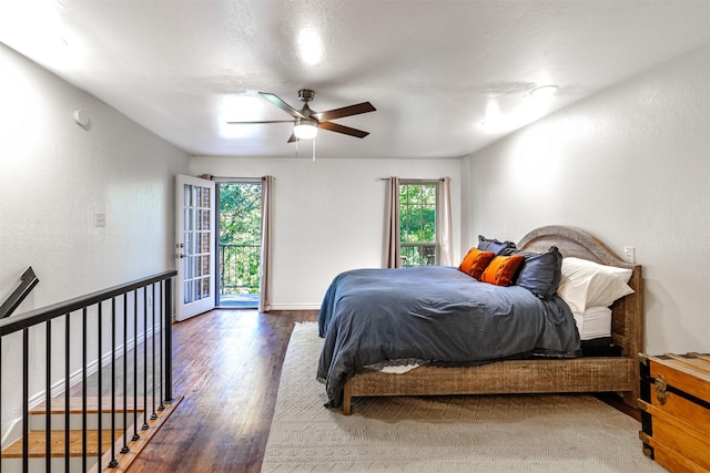 bedroom with ceiling fan, access to outside, and wood-type flooring