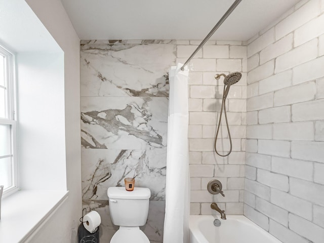 bathroom featuring toilet, plenty of natural light, tile walls, and shower / bath combo with shower curtain