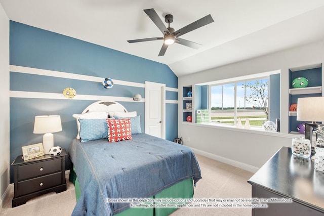 carpeted bedroom with vaulted ceiling and ceiling fan