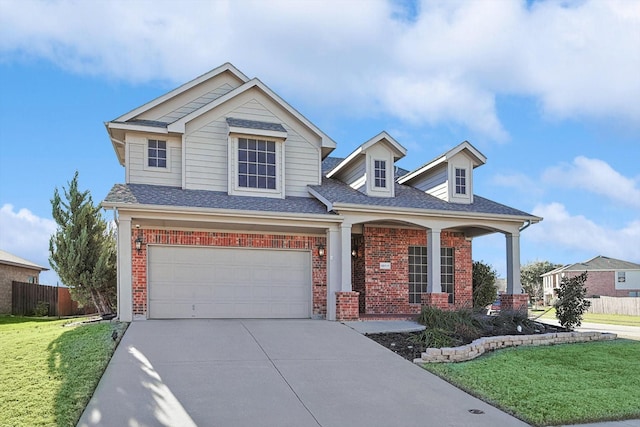 view of front of house featuring a garage and a front yard