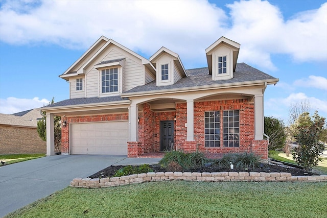 view of front of property featuring a garage and a front lawn