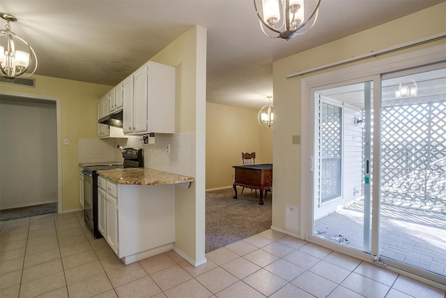 kitchen featuring white cabinetry, hanging light fixtures, black electric range, and light stone countertops