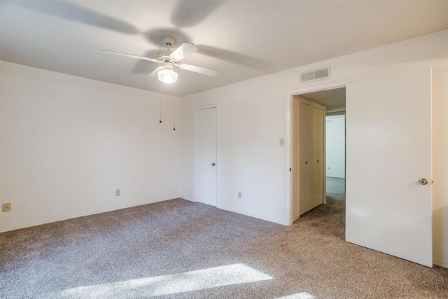 unfurnished bedroom featuring ceiling fan and carpet