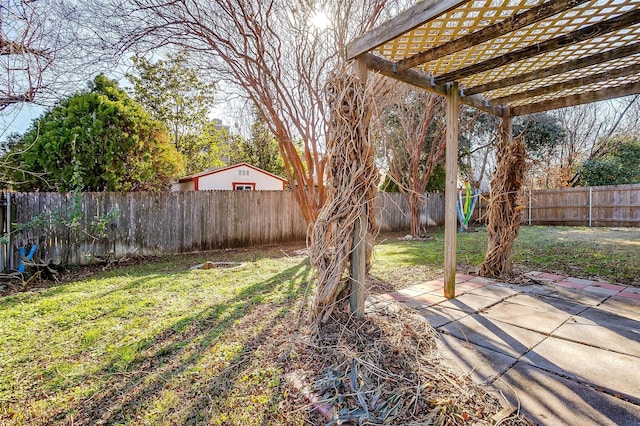 view of yard with a pergola and a patio