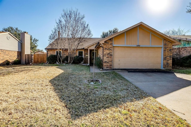 ranch-style house with a garage and a front lawn