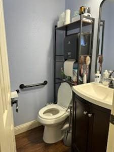 bathroom with toilet and vanity