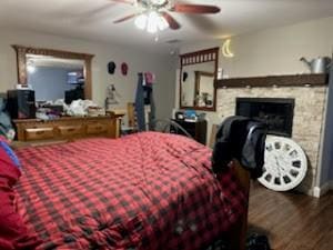 bedroom with ceiling fan and wood-type flooring