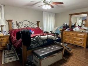 bedroom with ceiling fan and wood-type flooring