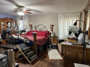 bedroom with ceiling fan and hardwood / wood-style floors