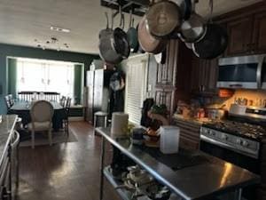 kitchen featuring dark brown cabinets and stainless steel appliances