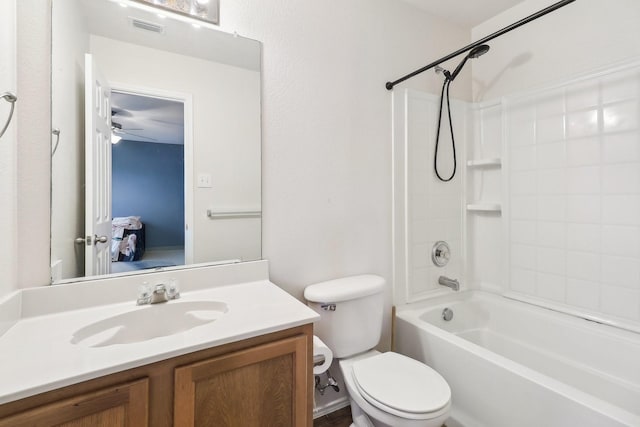 full bathroom featuring vanity, bathing tub / shower combination, and toilet