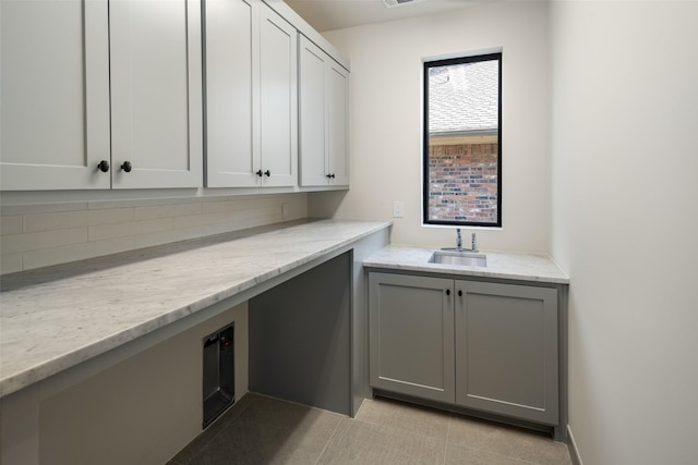 washroom with sink and light tile patterned floors