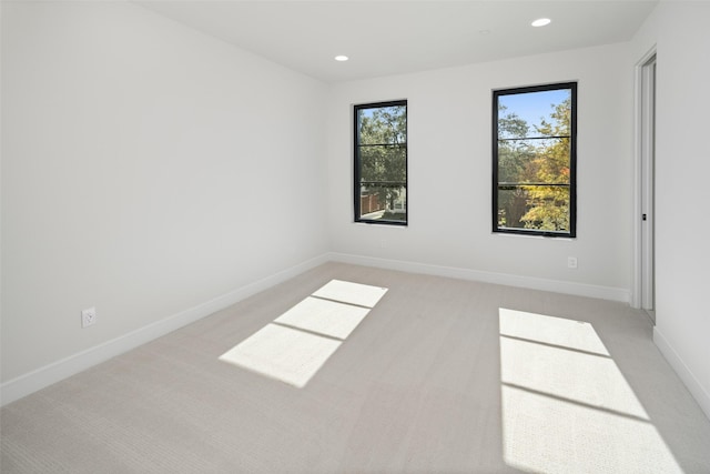 carpeted empty room featuring a healthy amount of sunlight