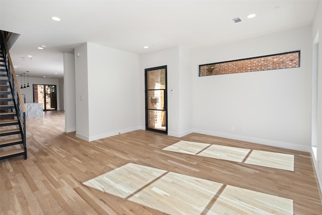 spare room with light wood-type flooring