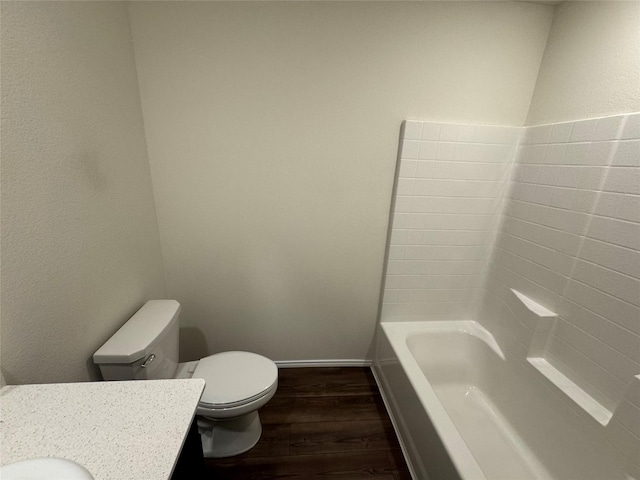 bathroom featuring hardwood / wood-style floors, vanity, and toilet