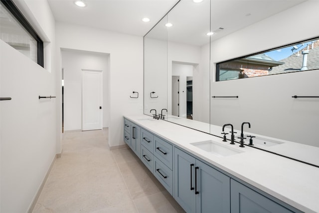 bathroom with tile patterned flooring and vanity