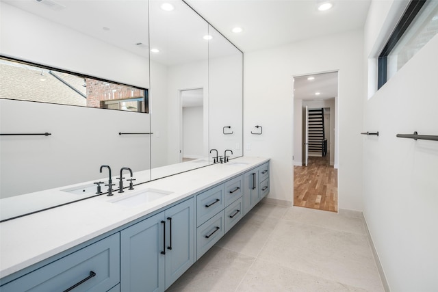 bathroom with tile patterned floors and vanity