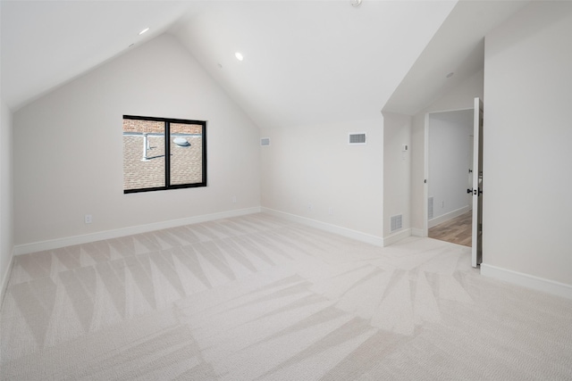 bonus room featuring light colored carpet and vaulted ceiling